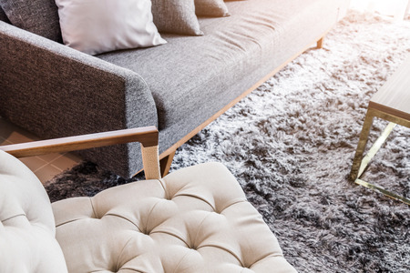 contemporary interior of Living room with part of sofa in sunny day and white curtain interior background conceptの写真素材