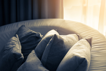 contemporary interior of Living room with part of sofa in sunny day and white curtain interior background conceptの写真素材