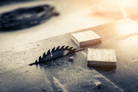saw machine slice wood block into two pieces with room renovation background construction conceptの写真素材