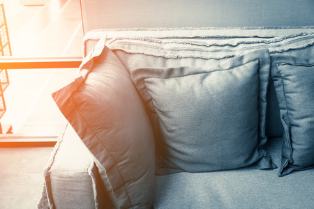 contemporary interior of Living room with part of sofa in sunny day and white curtain interior background conceptの写真素材