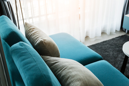 contemporary interior of Living room with part of sofa in sunny day and white curtain interior background conceptの写真素材