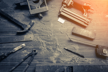 wood workshop with handcraft tools and raw wood on construction siteの写真素材