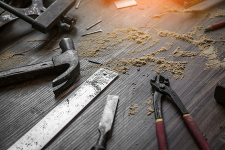 wood workshop with handcraft tools and raw wood on construction site