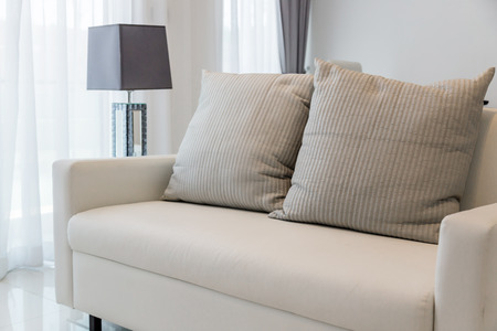 contemporary interior of Living room with part of sofa in sunny day and white curtain interior background conceptの写真素材