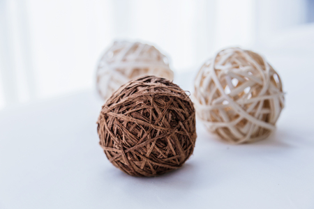 nature weave texture docorate ball with white backgroundの写真素材