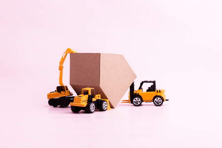 house construction business ideas concept with house cardboard paper and toy car with free copyspace for your textの写真素材