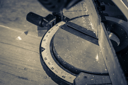 carpenter sawing wood work in workshop interior construction ideas conceptの写真素材