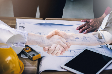 architect and engineer meeting concept with laptop  and documents with hand typing on laptopの写真素材