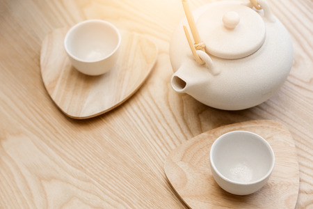 asian tradition white ceramic set on wooden table background with nature lightの写真素材