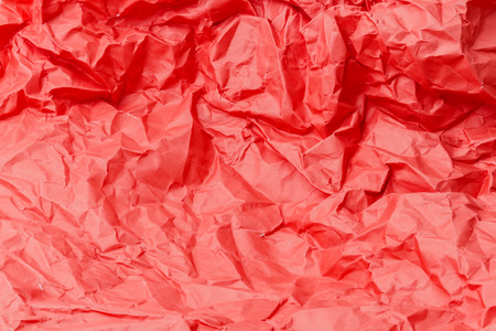 red crumpled wringled paper texture backgroundの写真素材