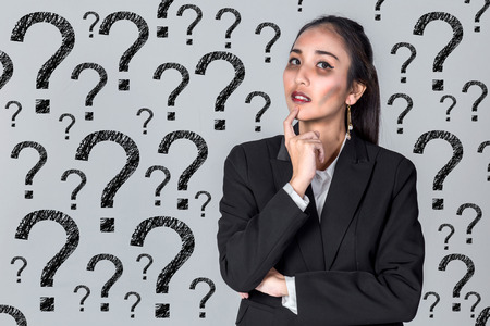 confused business girl with bad face and question mark symbol background