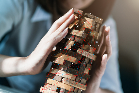 protection and security creativity ideas concept with balance wooden stack with hand protectの写真素材