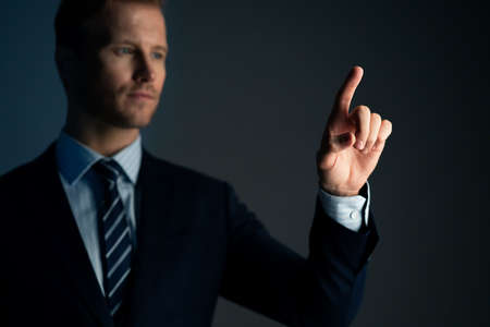 smart caucasian businessman formal suit portrait half body hand point copy space with dark color...
