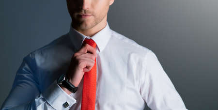 close up smart caucasian businessman with beard white shirt portrait half body dark color background copy spaceの写真素材