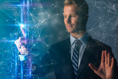 double exposure of elegant smart businessman hand touch digital technology screen data with light filter effect creativity ideas conceptの写真素材