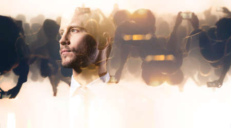 business caucasian man standing leadership in blur background people crowd double exposure image creative business strategy ideas conceptの写真素材