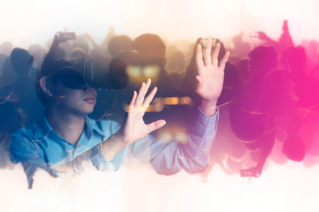 young asian officer man playing and hand touch effect of magic from Virtual reality with black...