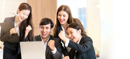 successful business ideas concept asian business female and male formal suit hand up with exited and...