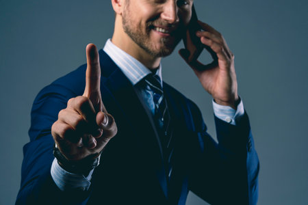 elegance caucasian Successful businessman  with beard close up wear formal suit tie grey backgroundの写真素材