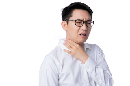 sick asian glasses male adult sore throat pain hand touch neck with stressful and tension white background health ideas conceptの写真素材