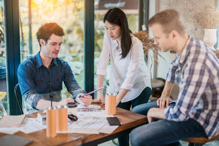 creativity brainstorm ideas concept with business partnet meeting workshop in coffeeshop and reflect of garden on windowの写真素材