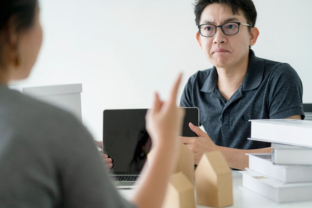asian glasses man stress arguing with co worker in meeting room office background