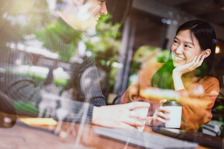 mix asian woman caucasian men People Meeting Friendship Togetherness and happiness enjoy at Coffee Shop Concept casual relax momentの写真素材
