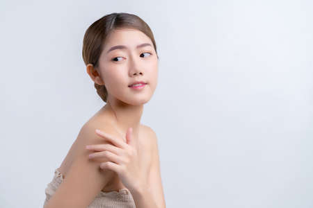 skincare and makeup concept beautiful asian female woman with healthy facial skin close up portrait studio shotの写真素材