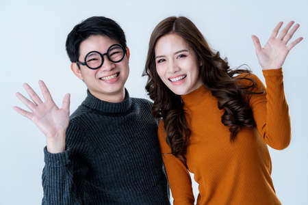 sweet asian couple traveller with happiness smile white backgroundの写真素材