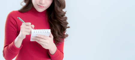 beautiful asian woman write down note in paper with happiness and joyful moment isolate white...