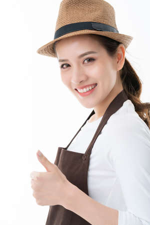 smart happiness asian friendly shop owner wear brown apron portrait half body smile and look to camera isolate white backgroundの写真素材