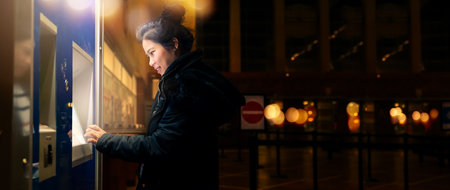 asain female woman  traveller withdrawing money from credit card at ATM nighttime with light bokeh...