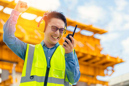 successful handup smart asian engineer manager with safety uniform checking site construction with...