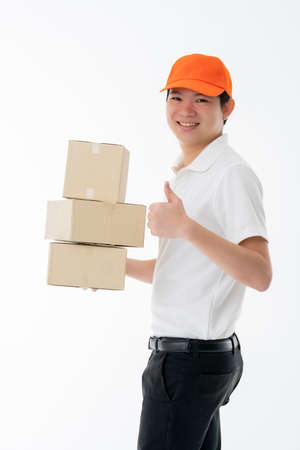 smart asian  messenger delivery man hand hold product boxes portrait half body isolate white backgroundの写真素材