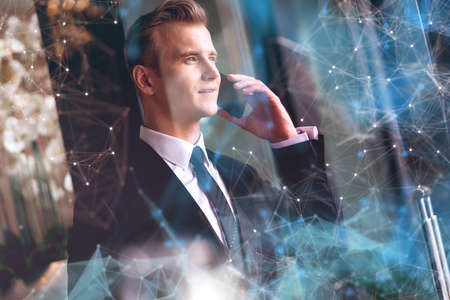 smart handsome caucasian executive officer work and contact client with smartphone with  connecting...