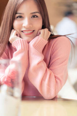 attractive asian beautiful female woman long hair casual summer cloth pink color dress smiling cheerful freshness morning moment  carefree lifestyle travel vacation momentの写真素材