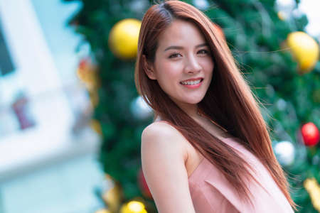 attractive asian beautiful female woman long hair casual summer cloth pink color dress smiling cheerful freshness morning moment  carefree lifestyle travel vacation momentの写真素材