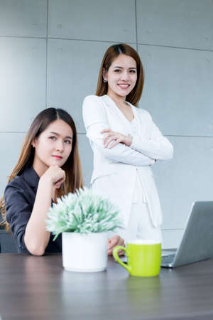 asian smart successful business woman smile with confident with startup partner office backgroundの写真素材