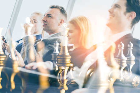 successful business teamwork double exposure image of business partner with chess board game color...