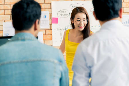 Group of colleagues having an informal meeting ,Business people discussing ideas in officeの写真素材