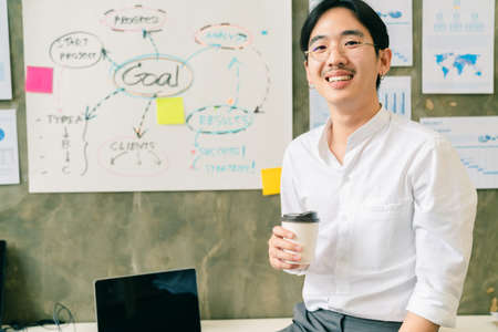 young smart asian entrepreneur startup company portrait smileing with successful and confident in...