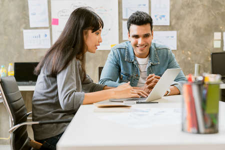 small group of creative startup business brainstorm meeting casual strategy direction together in...