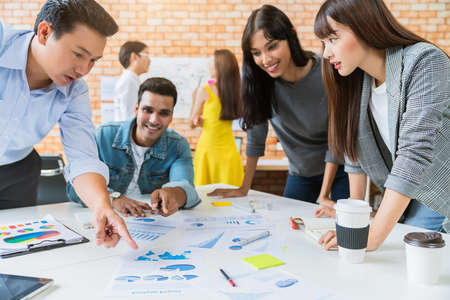 Happy businessman teamwork brainstorm and discussing on white table during business presentation in the office.の写真素材