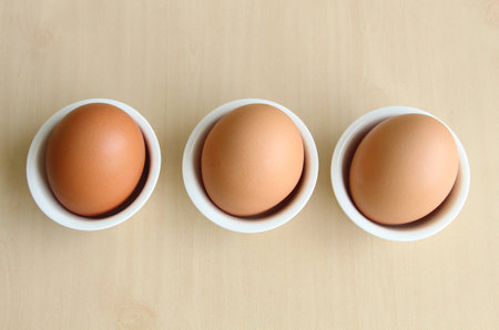 Top view of egg on wooden backgroundの写真素材