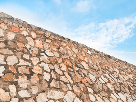 Stonewall texture on blue skyの写真素材