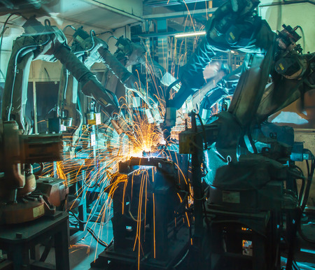 Team welding Robot movement Industrial automotive part in factoryの写真素材