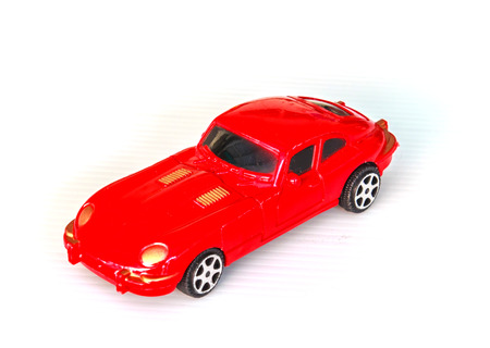 red toy car isolated on white
