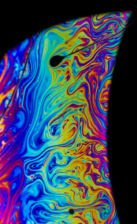 Rainbow colors created by soap, bubble,or oil makes can use for backgroundの写真素材