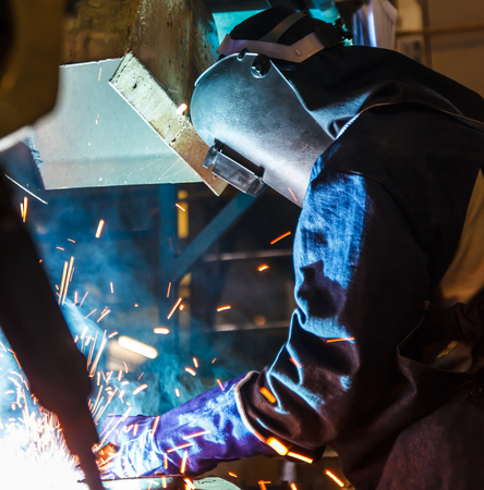 Industrial steel welder in factory,cars