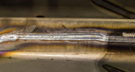 welding seam onto steel sheet metal Industrial steel welder in factoryの写真素材